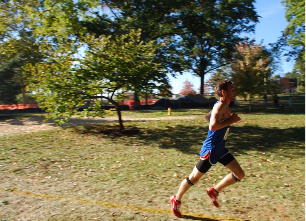 Senior Parker Schultz runs in the varsity cross country race at the Clayton Invitational in Shaw Park, later placing first in the varsity boy's division.