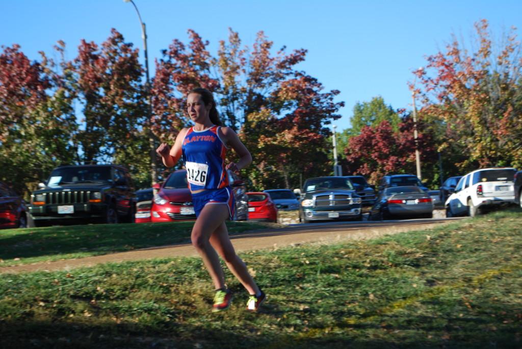 Sophomore Gabby Boeger runs in the Clayton Invitational in Shaw Park on Friday. Boeger came in second on the Clayton girl's varsity team behind senior Lauren Indovino.