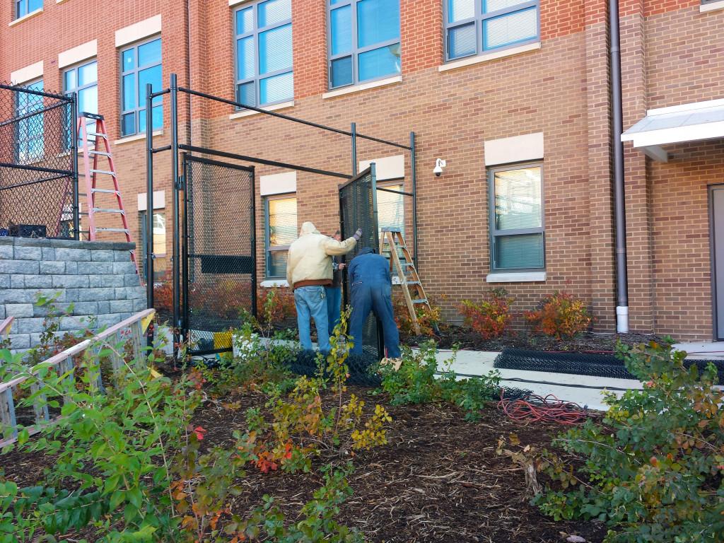 Clayton maintenance workers install the new fence between the quad and the center. The fence is part of a new program to improve CHS safety after recent school shootings across the nation.