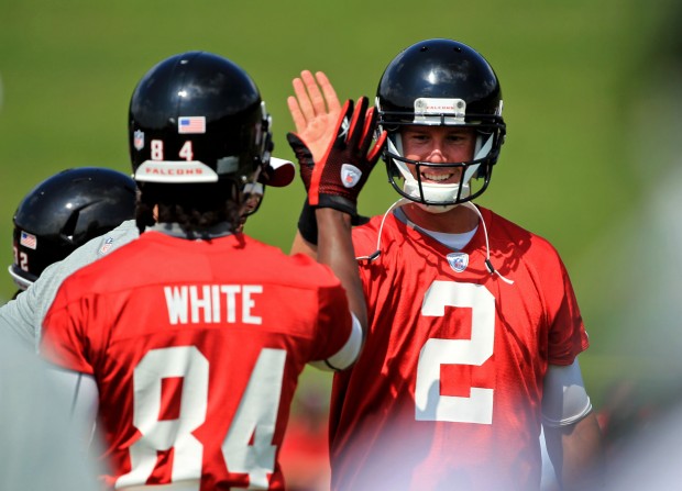 Atlanta Falcons wide receiver Roddy White, left, and quarterback Matt Ryan celebrate a play during a break in the second day of minicamp in Flowery Branch, Georgia on Wednesday, June 20, 2012. (Jason Getz/Atlanta Journal-Constitution/MCT)