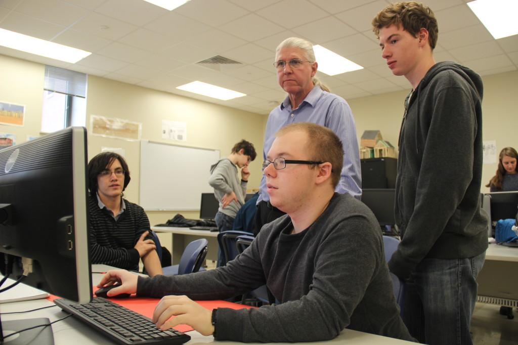 Programming leaders Josh Portman and Chris Cormier discuss with teacher-mentor Mr. Gladstone about plans for the upcoming FIRST Robotics competition. The FIRST competition combines technology, science, and team work. Team 4500 , the CHS Robohounds are gearing up to win!