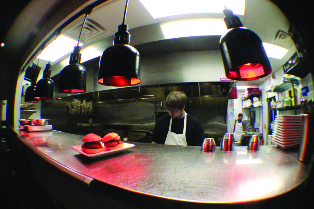 The kitchen at 5 Star Burger in Clayton (Noah Engel). 