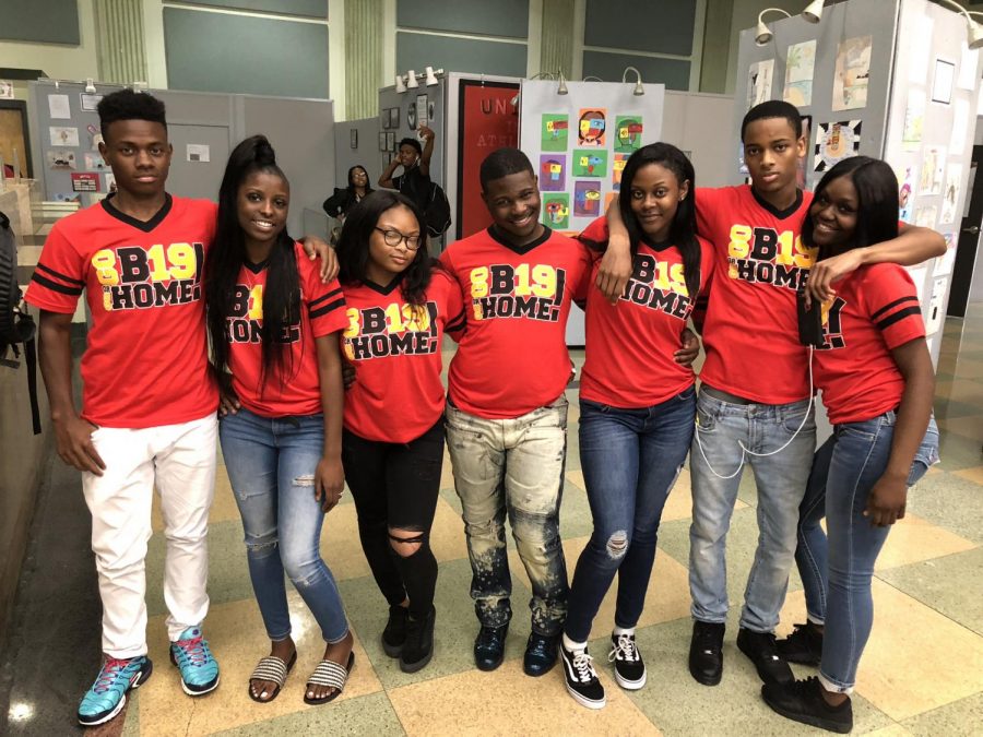 Senior Justin Plummer (center) and friends pose together.