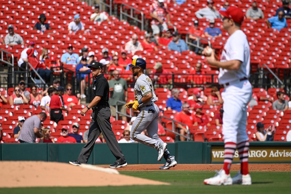 The Milwaukee Brewers' Blake Perkins, middle, rounds the bases after hitting a solo home run against St. Louis Cardinals pitcher Miles Mikolas, right, in the third inning at Busch Stadium on Thursday, Sept. 21, 2023, in St. Louis.