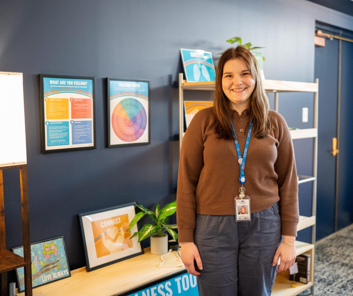  Wellness Outreach Specialist Grace Sullentrup enjoys the couches and comfortable seating areas in the Wellness Center. She usually keeps the overhead lights off, preferring to light the space with lamps. 