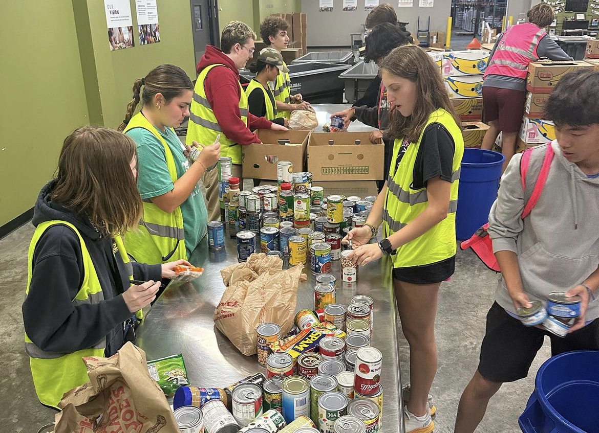 Students box up food to deliver to families, through Operation Food Search on Jan. 4.
