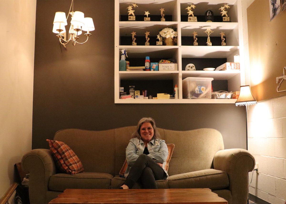 Kelley Weber sits on a couch in her cozy office down the hall from the black box and the theater. 