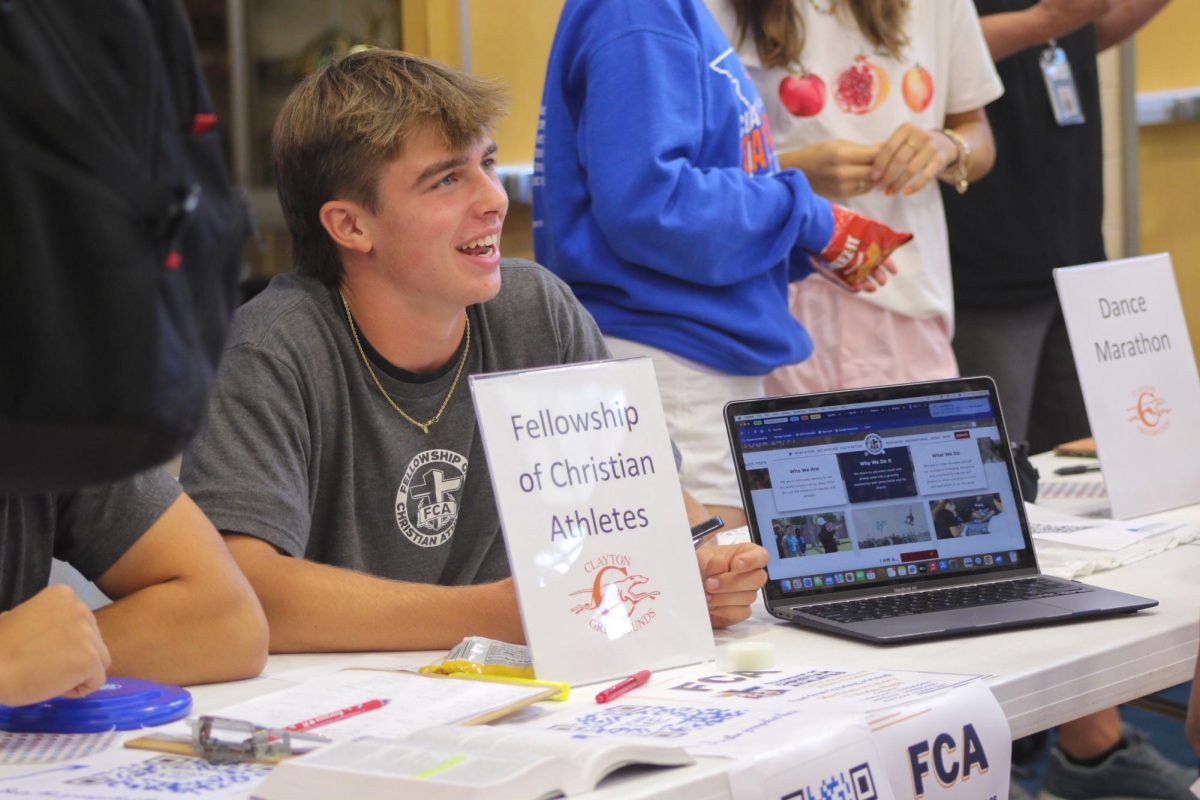 Senior Tommy Leary encourages 
students to sign up for the FCA. Leary 
has been a dedicated member of the 
FCA for four years, serving as a leader 
and mentoring younger members. 