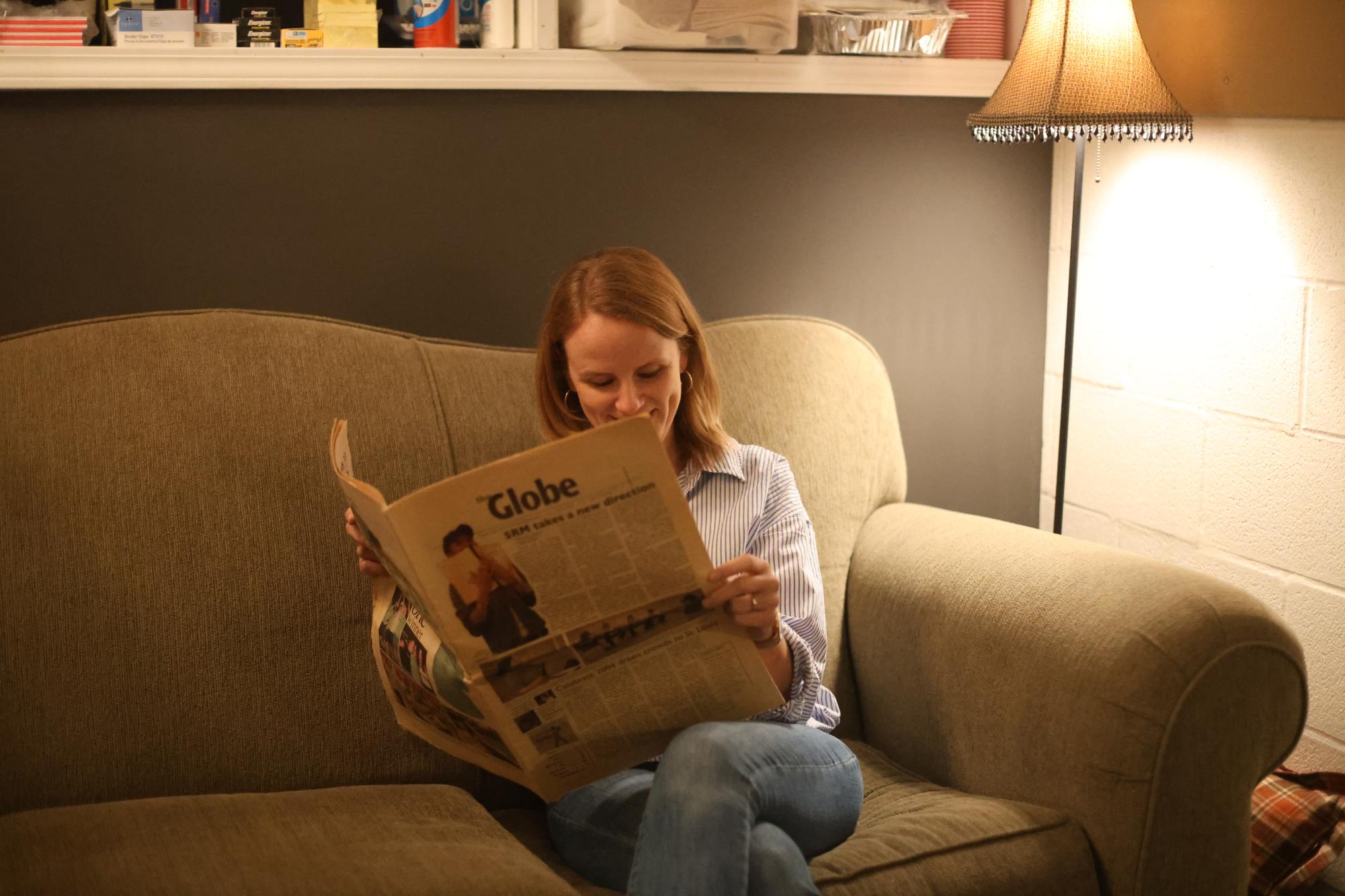 Theater Director Mallory Duncan holds the 2004 Globe issue, with her picture on the cover as a senior. Duncan played a central role in the cover story, where her creativity and hard work behind the new Student Run Musical were showcased.