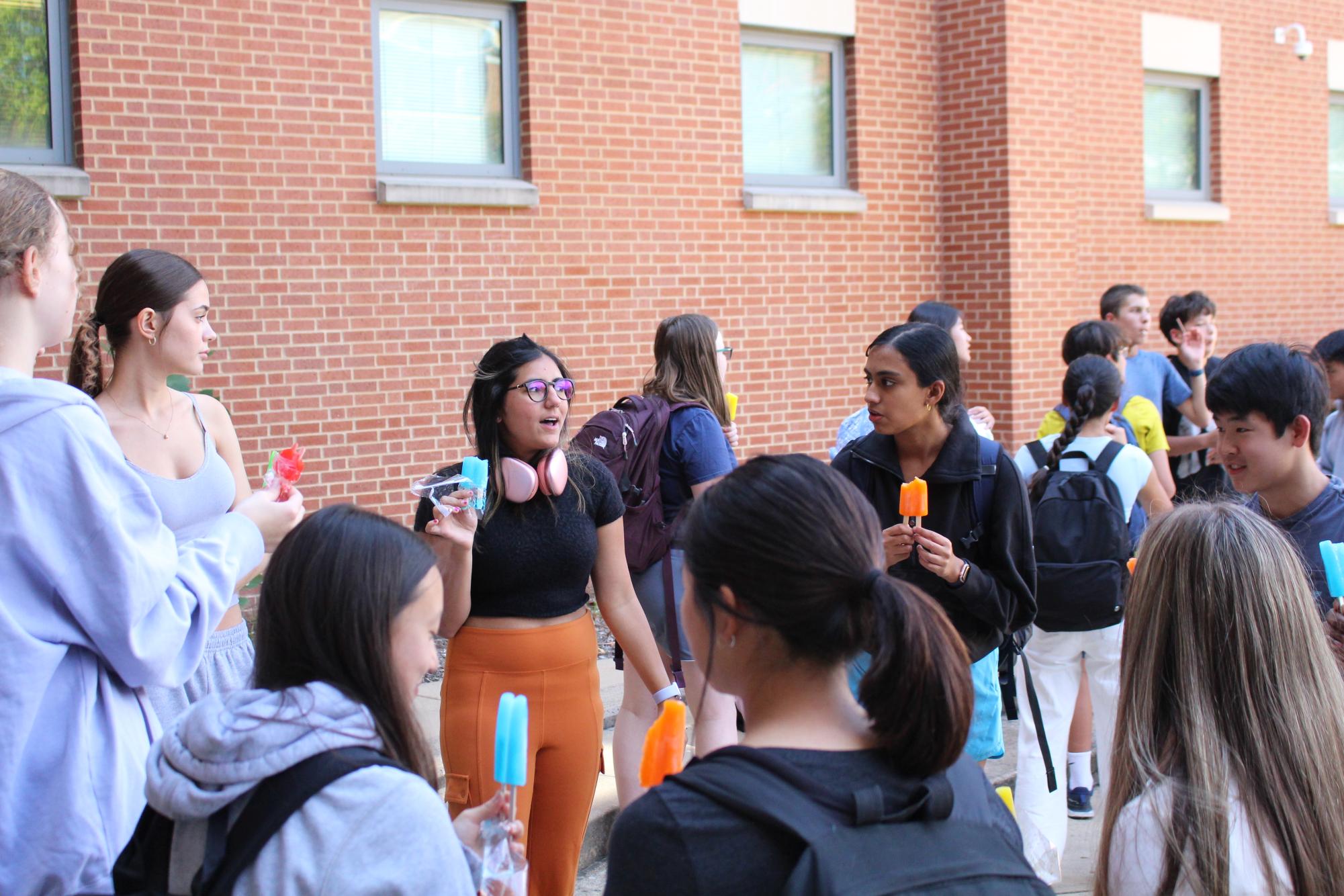 Freshman share Popsicles with their Link Crew Leaders in the Quad at the end of the school day on their first Friday of the 2024 School Year.