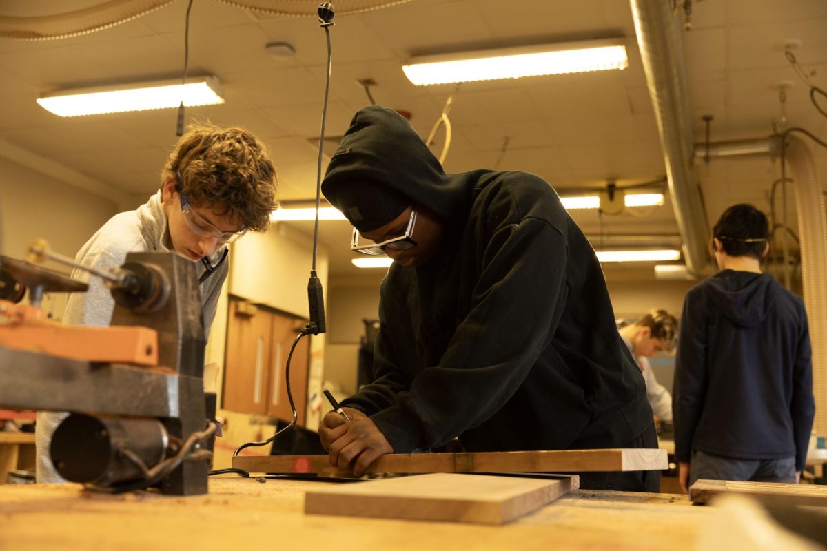 Sophomores Asher Levey and TreShaun Dent work in their Construction Tech class.