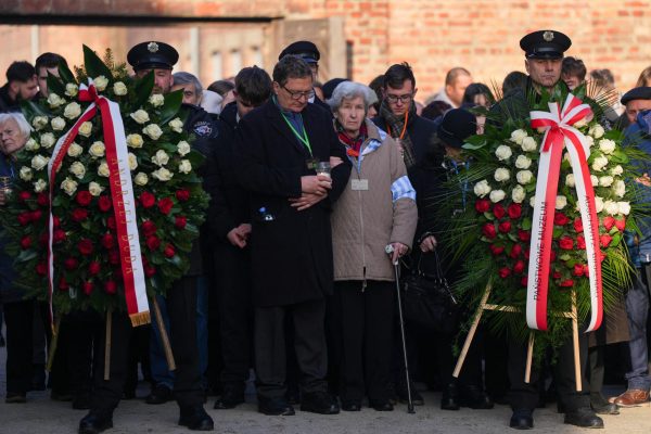 A survivor attends wreaths laying ceremony at the Death Wall during the 80th anniversary of the liberation of the Nazi German Auschwitz-Birkenau concentration and extermination camp in Oswiecim, Poland January 27, 2025.