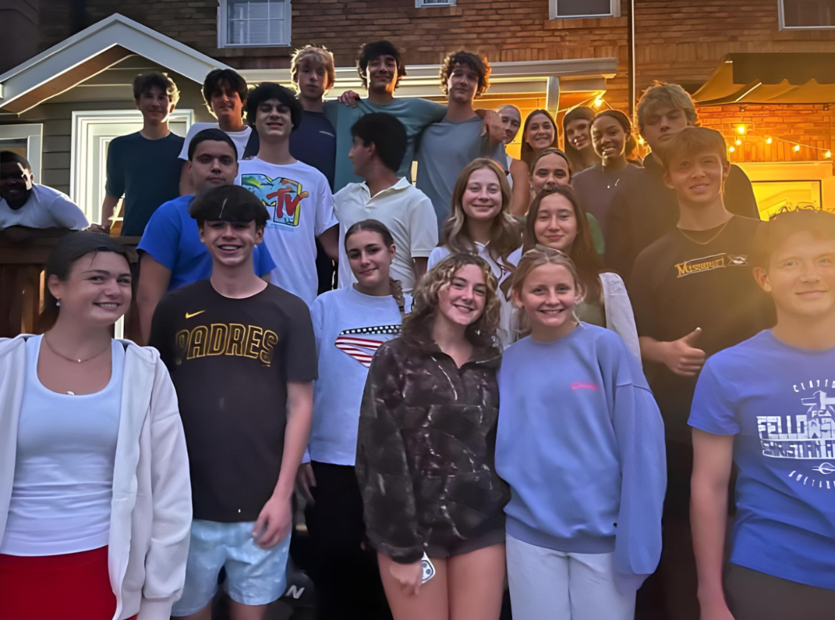 The Fellowship of Christian Athletes pose for a photo at the front lawn of one of the leaders houses. The club members are food and played games. "It was really great to be able to talk and hangout with kids in the FCA outside of school. It felt nice talking to them and also having fun outside of a school environment," Cole Rideout said.