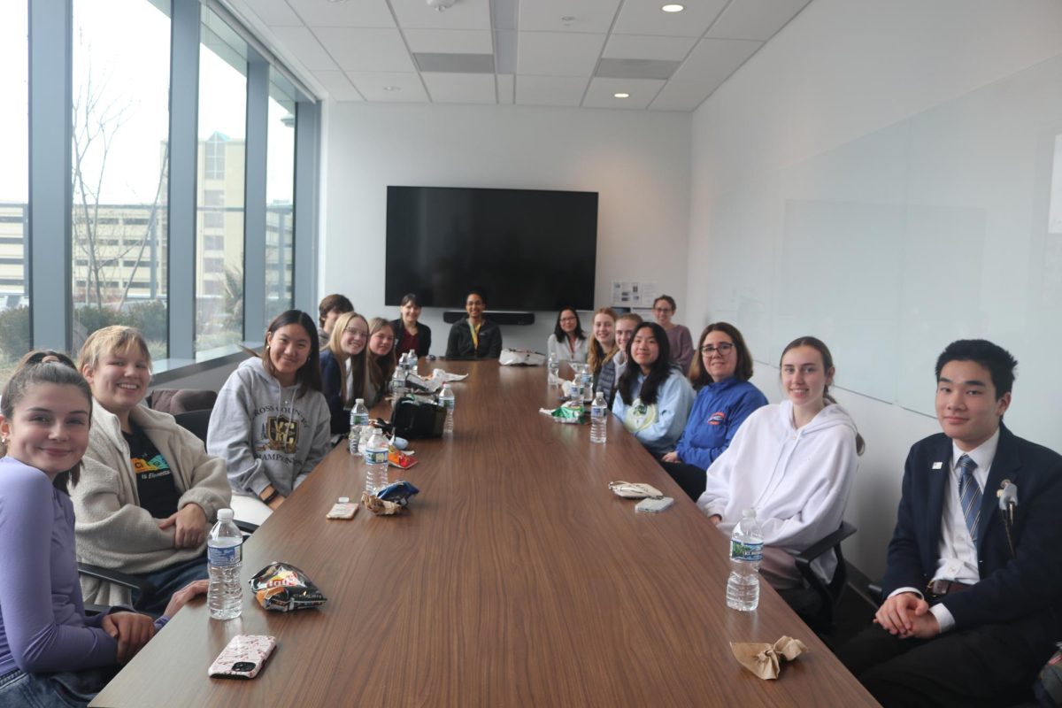 Students in SWENext (Society of Women Engineers) gather in the Washington University Neuroscience building to hear from Tim Miller, a MD PHD who works with neurodegenerative diseases. The students then heard from a panel of four women who work within the facility.