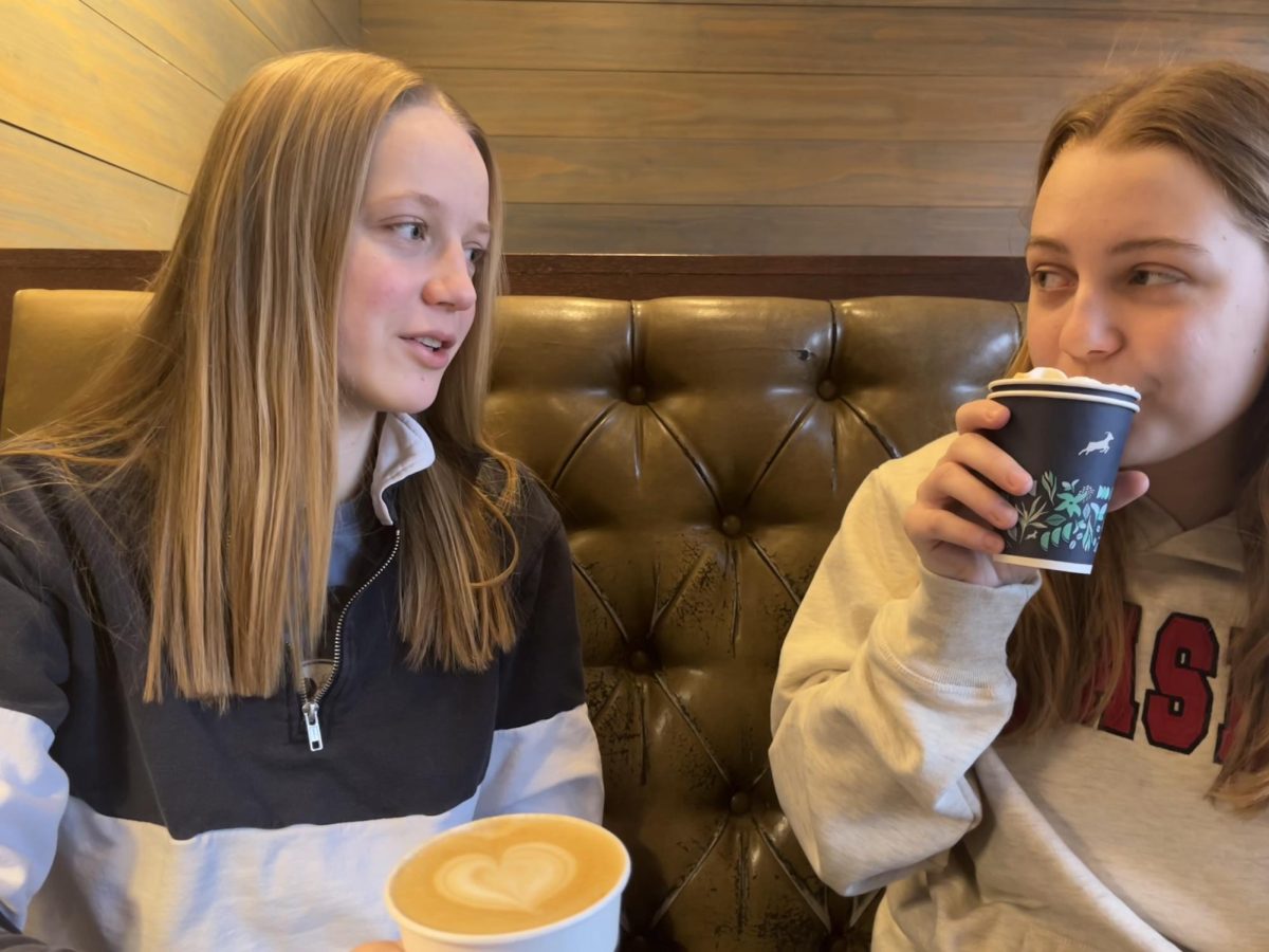 7:10 a.m.
Early on Wednesday morning, seniors Analee Miller and Madeline Jeans enjoy their breakfast at Kaldi’s coffee. Miller, a barista at Kaldi's, recommended that they get mochas with whipped cream. “We go to Kaldi’s every Wednesday morning. It’s a fun tradition and a good way to start our day,” Jeans said. Photo by Luke Jeans
